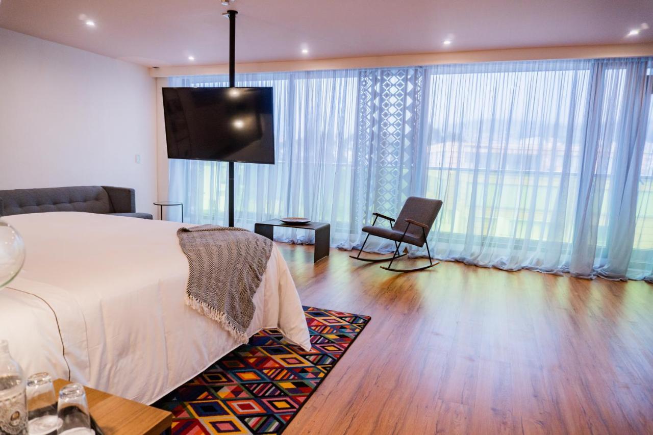 Hotel V1501 Pasto Exterior foto A bedroom at the hotel