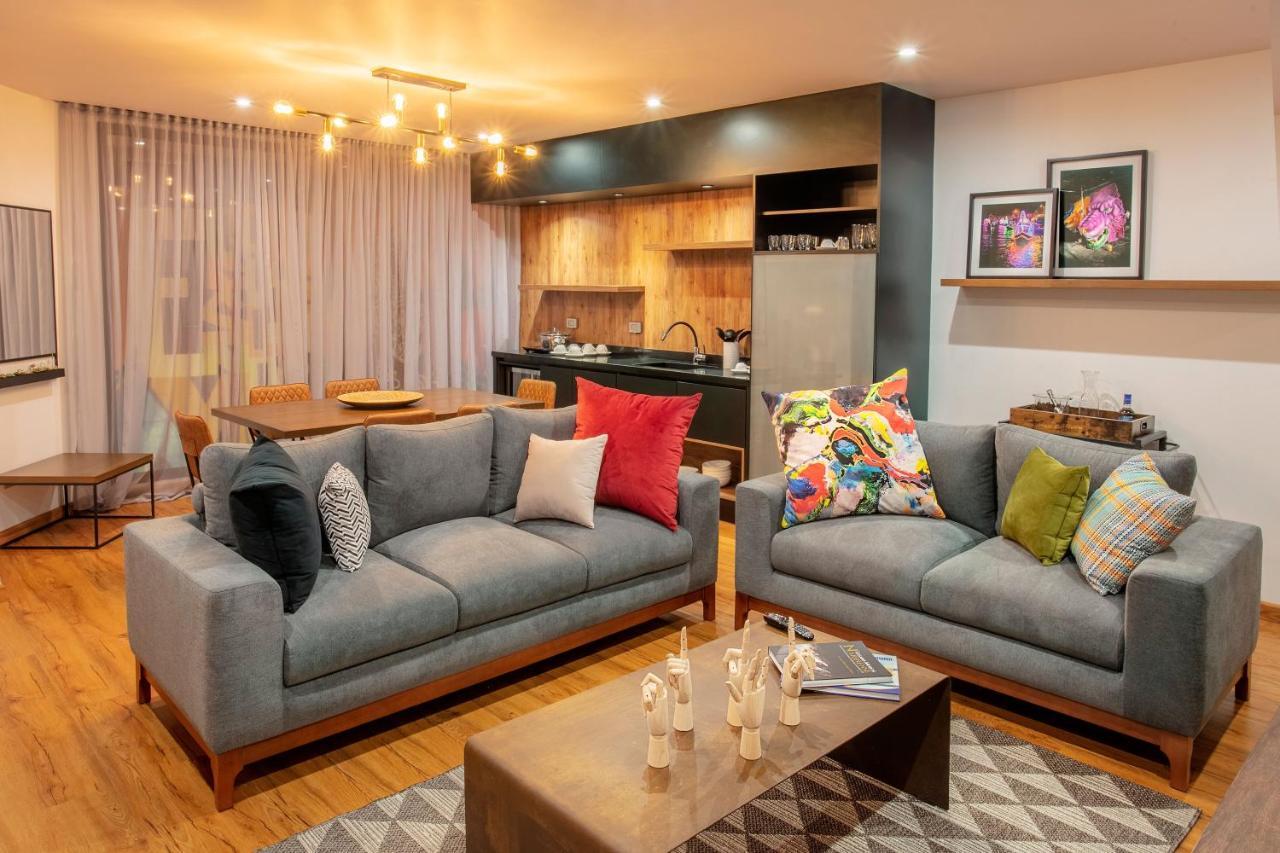 Hotel V1501 Pasto Exterior foto A living room with a sofa
